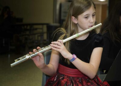 A Young Girl Playing Flute